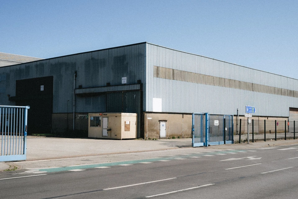 A warehouse beside a road on an industrial estate.
